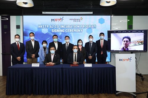 Officiating guests at the signing ceremony:  Alfred Sit, JP, Secretary for Innovation and Technology (5th from left, 2nd row) Annie Choi, JP, Permanent Secretary for Innovation and Technology (3rd from left, 2nd row) Rebecca Pun, JP, Commissioner for Innovation and Technology (4th from right, 2nd row) Sunny Chai, BBS, Chairman of HKSTP (4th from left, 2nd row) Michael Lai, General Manager of AstraZeneca China (right, 2nd row) Albert Wong, CEO of HKSTP (left, front row) Gwenael Meneux, General Manager of AstraZeneca Hong Kong and Macao (right, front row) Eugene Hsia, Chief Corporate Development Officer of HKSTP (2nd from left, 2nd row) Reza Nobar, Director of Innovation and Business Excellence of AstraZeneca Hong Kong (2nd from right) John Kao, Head of BioMedical Technology Cluster of HKSTP (left, 2nd row) Chris Chow, Senior Manager of Government Affairs and Market Access of AstraZeneca Hong Kong (3rd from right, 2nd row)